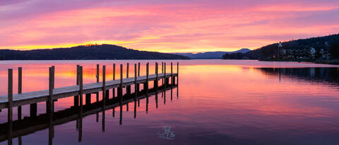 Pink Sunrise and dock in Meredith Bay on Lake Winnipesaukee