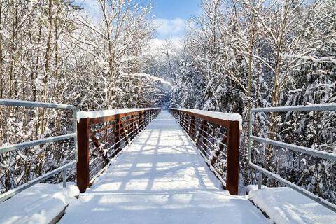 Pedestrian Bridge covered in a fresh blanket of snow in Bristol, NH