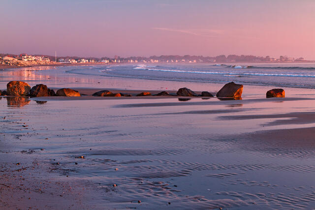 Pink dawn on the beach during low tide at Rye Beach in Rye, NH