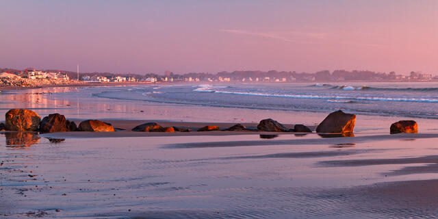 Pink dawn on the beach during low tide at Rye Beach in Rye, NH