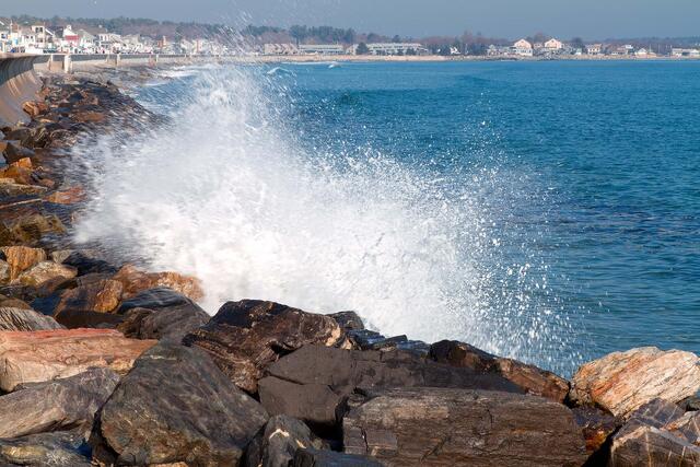 Splash on the rock wall of North Beach in North Hampton, NH