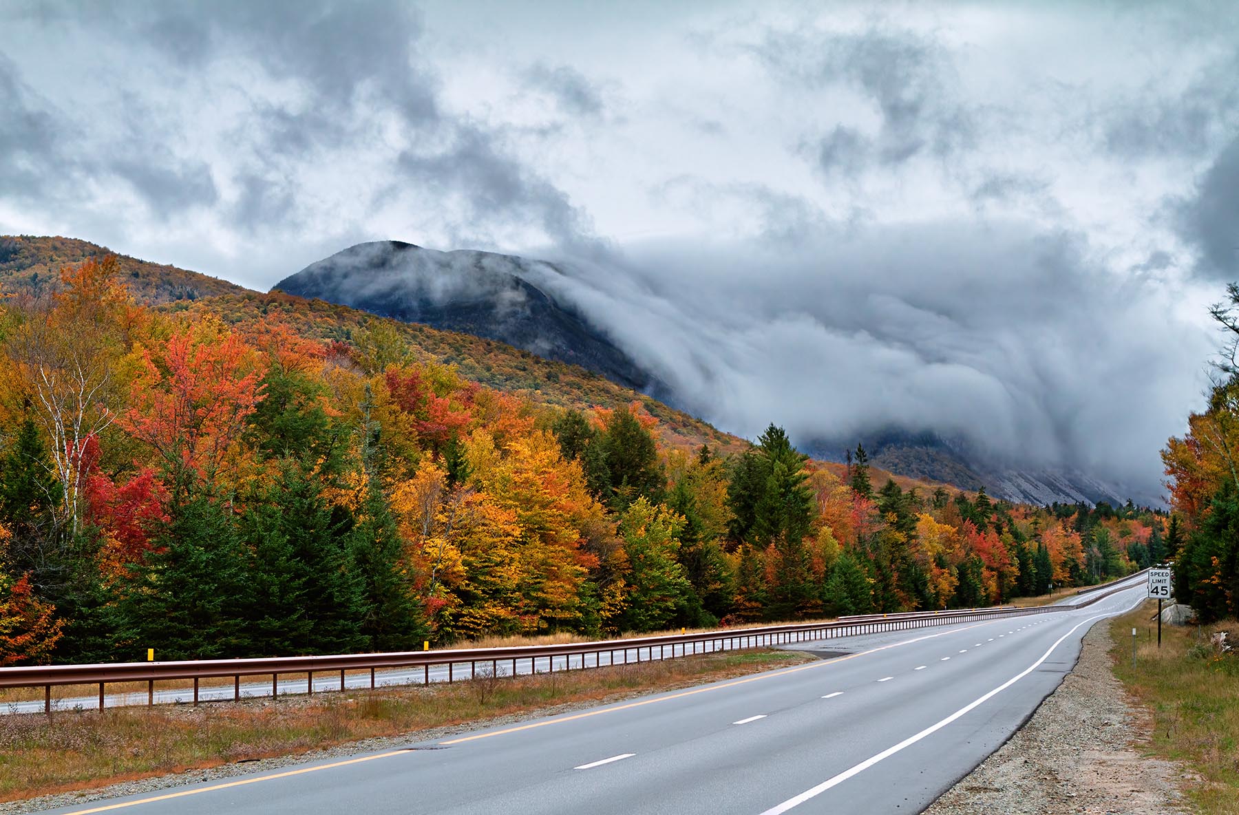 Rolling Fog Over Cannon Cliffs, Cannon Mtn Rolling fog curled over Cannon Cliffs dressed for autumn in Franconia Notch State Park