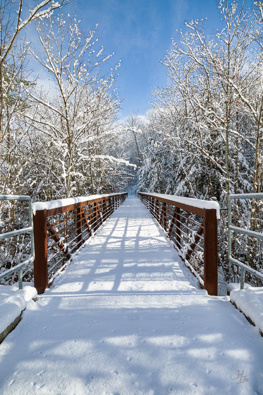 Snowy Foot Bridge Bike Path Pedestrian Bridge covered in a fresh blanket of snow in Bristol, NH