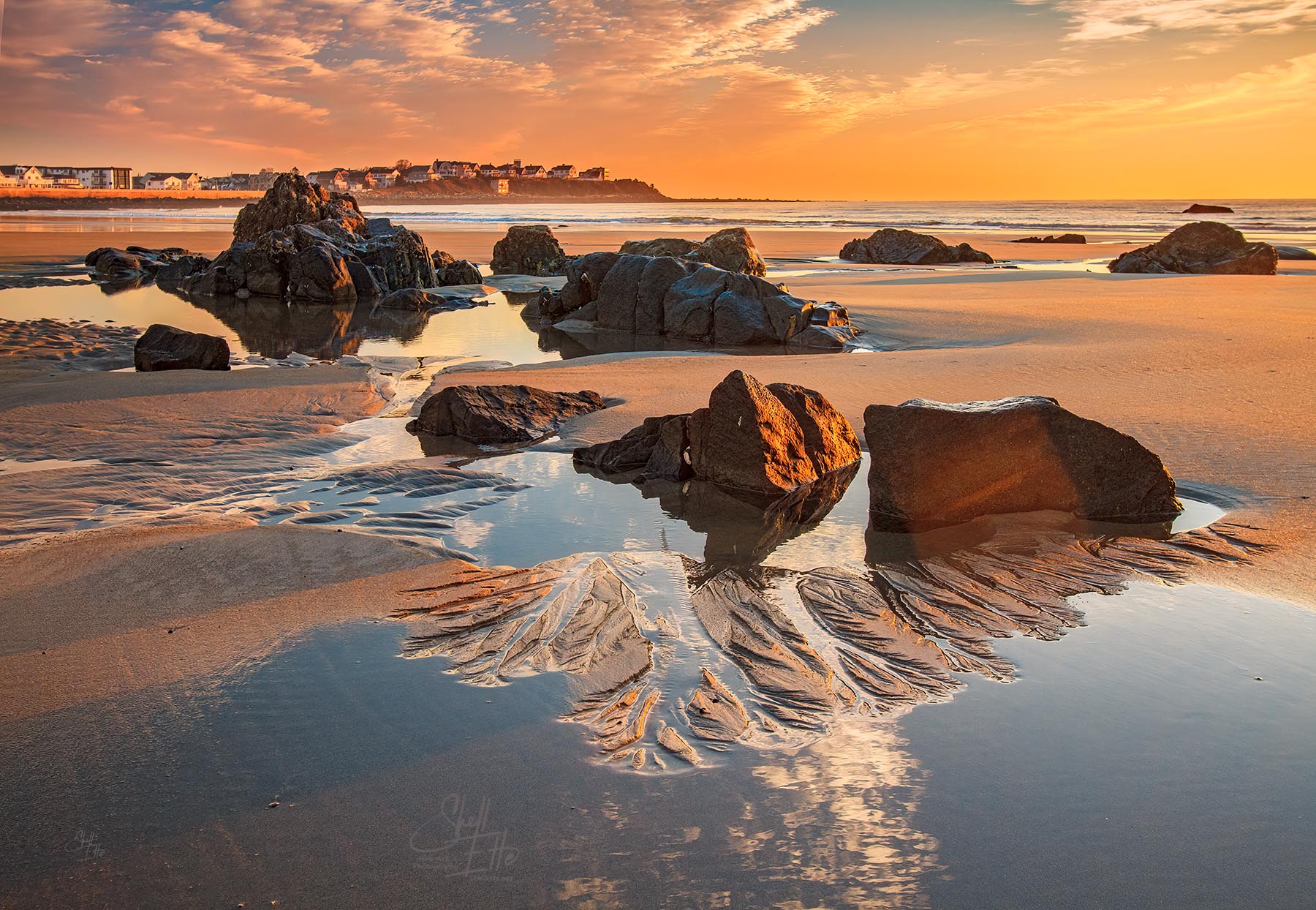 Rock Pools Low Tide Sunrise Rocks reflecting in the low tide pools during sunrise at Hampton Beach in NH.