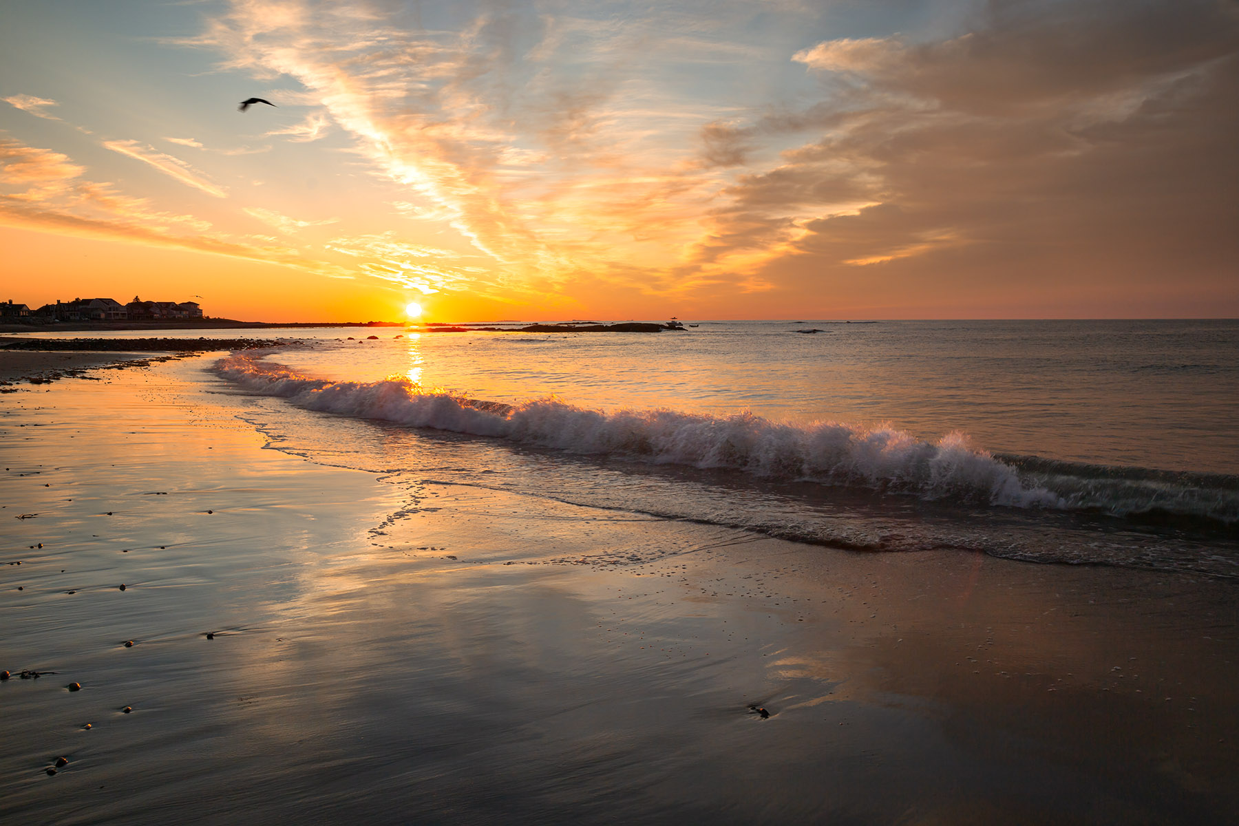 Sunup Splash Beach Sunrise A waves splashes on shore catching the sunrise at North Beach in Hampton, NH