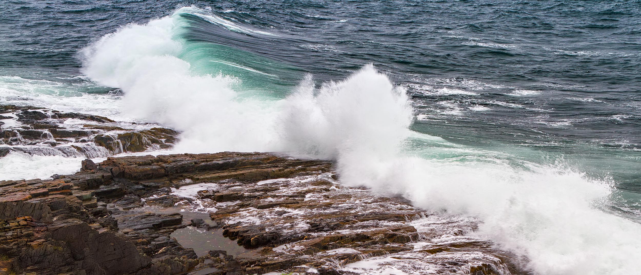 Storm Wave on Maine Shore Storm wave crashes on the rocky shore in York, ME